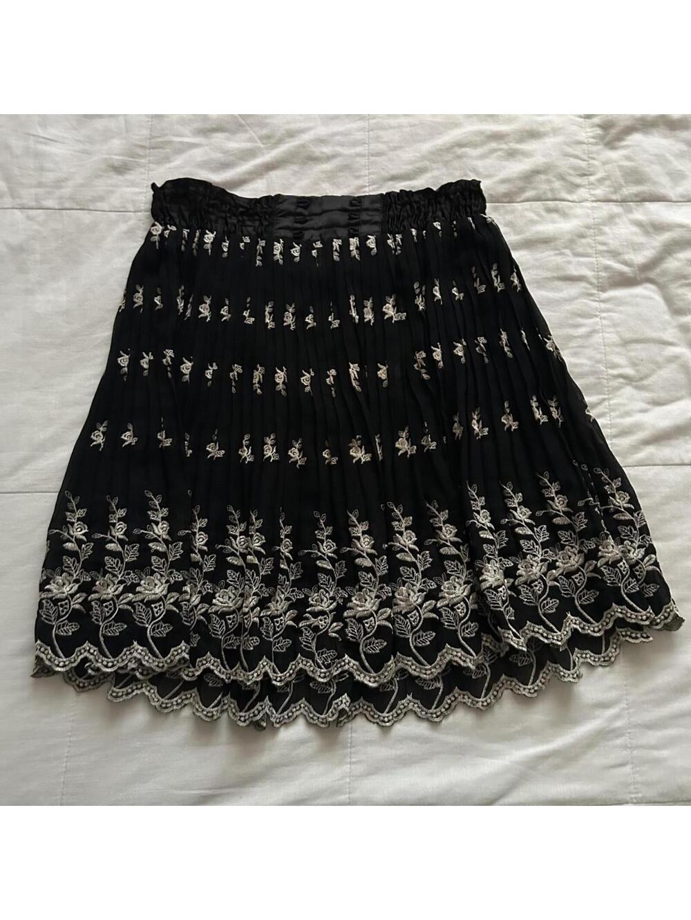 Axes Femme black skirt featuring delicate floral embroidery